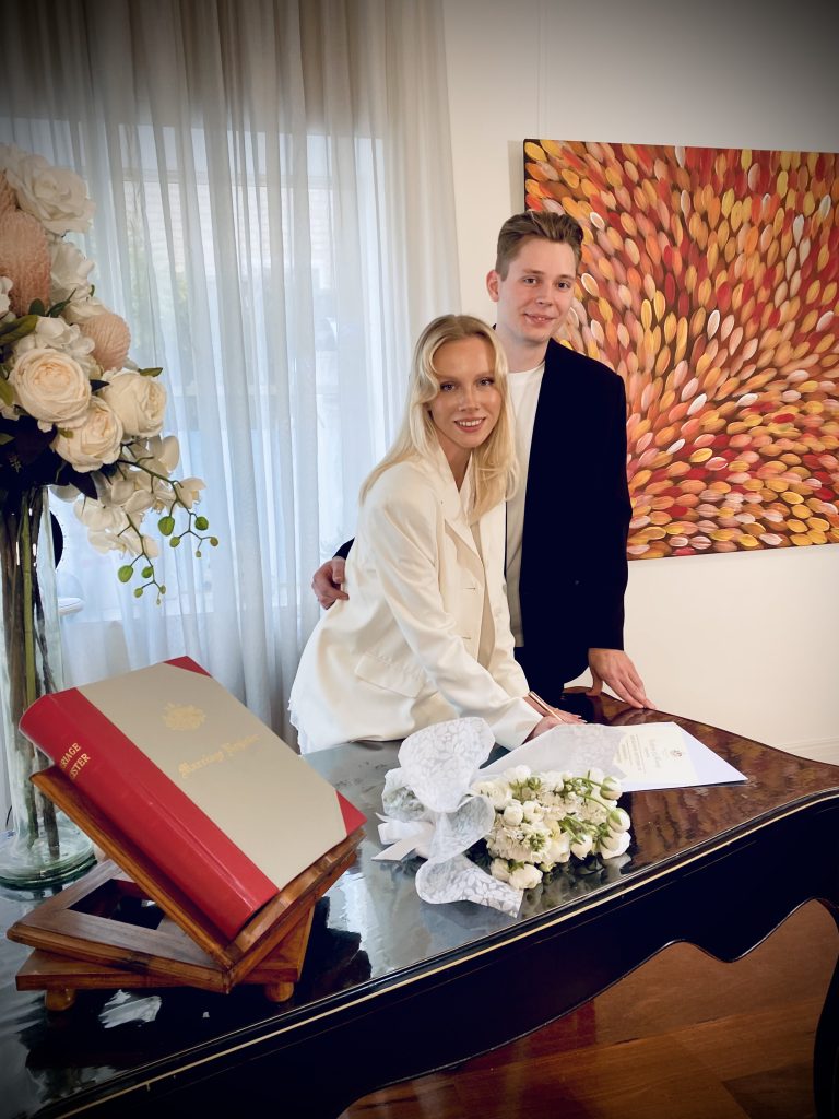Couple signing marriage certificate at Melbourne Marriage Registry